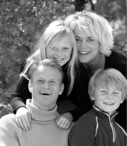 Family - mother, father, son and daughter smiling