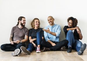 a group of friends smiling and talking to each other