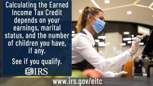 A cashier at a grocery store entering an item code into the register and the text: Calculating the Earned Income Tax Credit depends on your earnings, marital status, and the number of children you have, if any. See if you qualify. www.IRS.gov/EITC