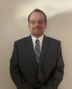 Headshot of Rodney Patten in a suit