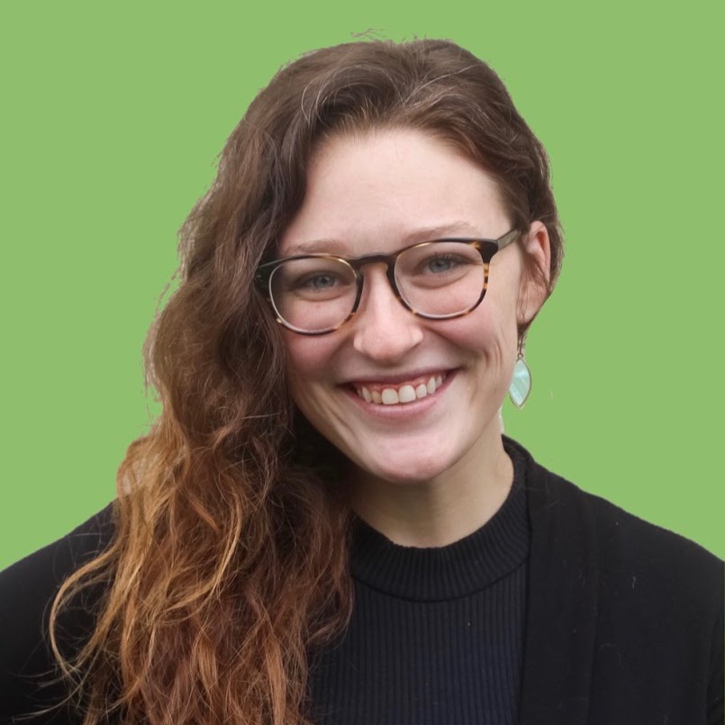 Headshot of Laine Hodges with green background