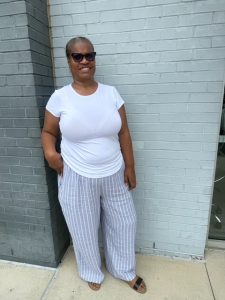 Teresa Smalls, a woman with short, salt-and-pepper colored hair, posing for a photo outside of a brick building